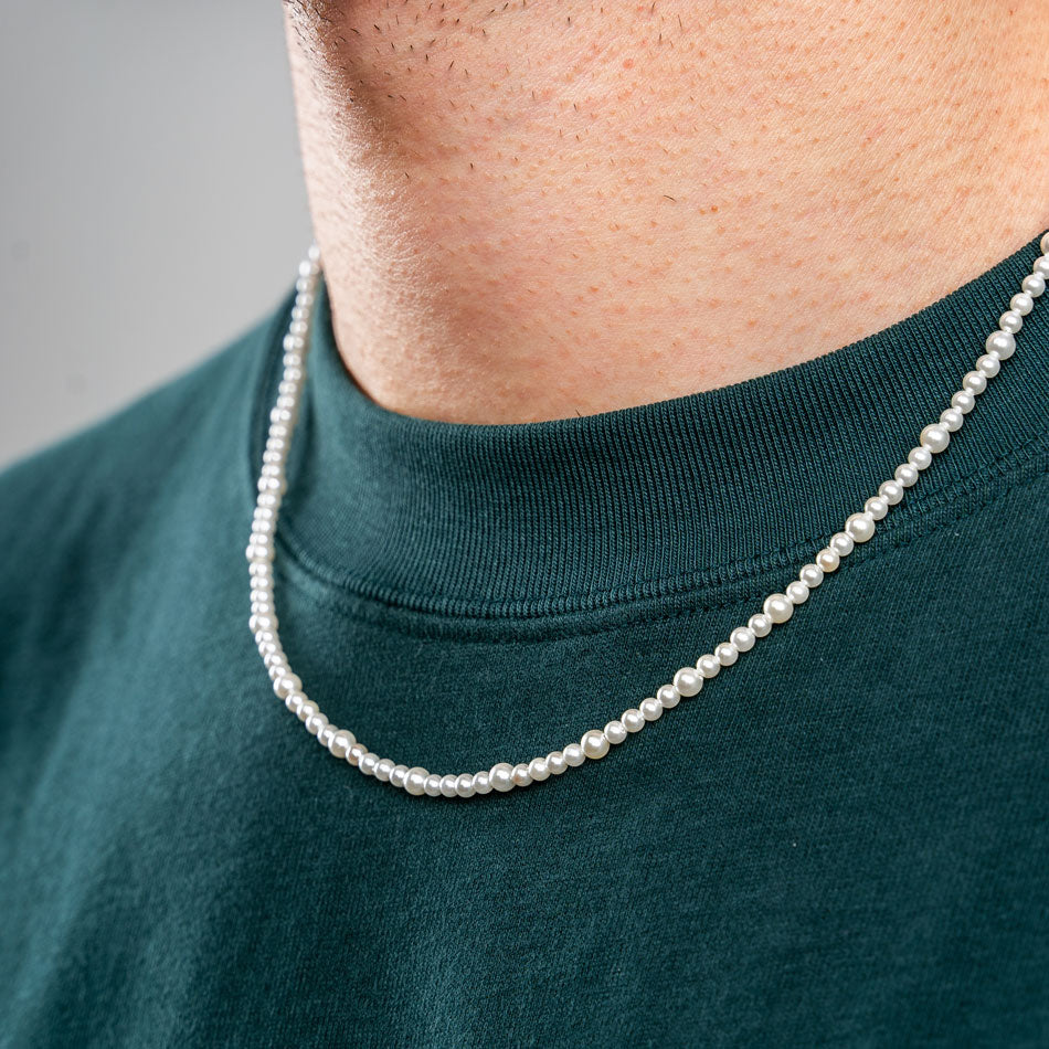 Our Asymmetric Pearl Necklace has been crafted using different sized polished white pearls, along with the finest silver hardware to hold it all together.